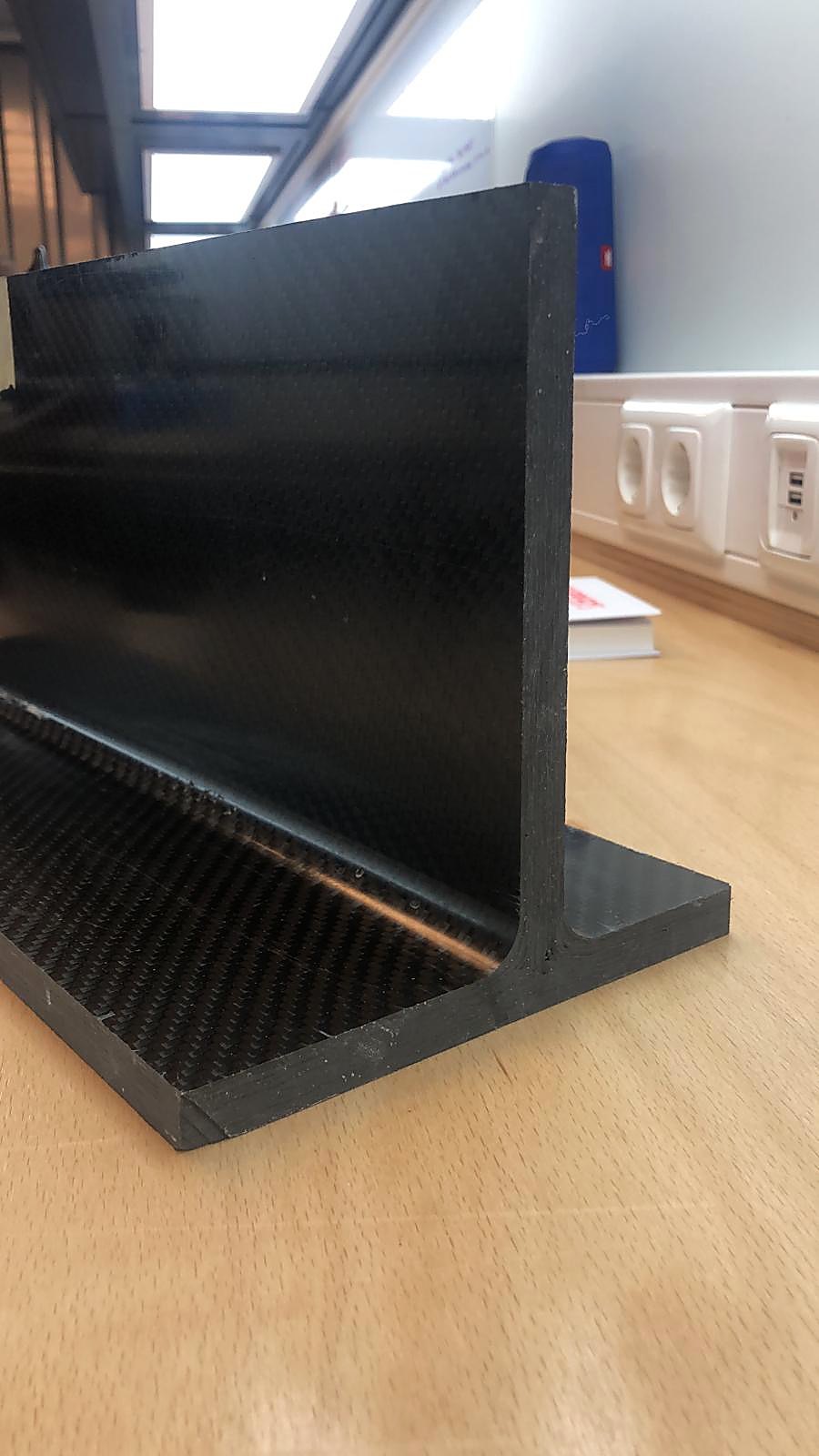 Carbon fiber beam for ceramic machinery